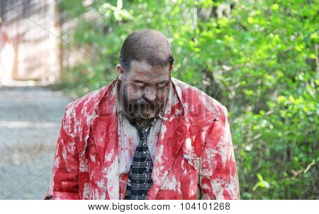 MUSKOGEE, OK - Sept. 12: A man dressed as a zombie waits for runners during the Castle Zombie Run at the Castle of Muskogee in Muskogee, OK on September 12, 2015.