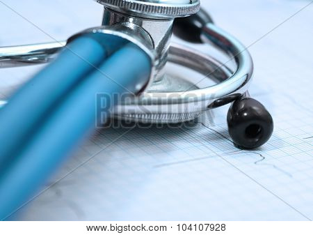 Close Of The Stethoscope On The Surface Of Ecg Paper