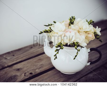 white roses and freesias