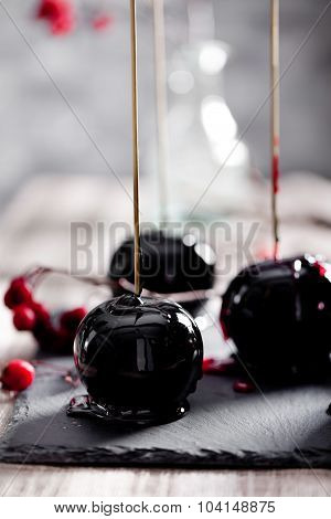 Halloween black and red caramelized apples