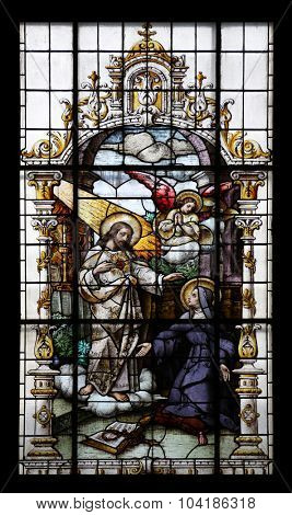ZAGREB, CROATIA - MAY 28: Jesus and Saint Margaret Mary Alacoque, stained glass window in the Basilica of the Sacred Heart of Jesus in Zagreb, Croatia on May 28, 2015