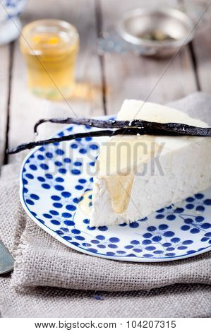 Vanilla and honey cheesecake on a blue plate