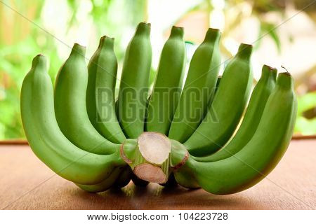 Raw Banana On A Wooden Table.