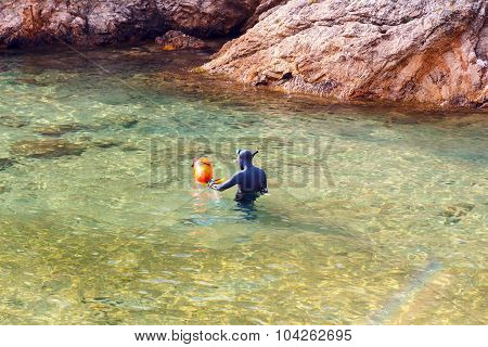 Diver in the bay of Cala Bona. Tossa de Mar.