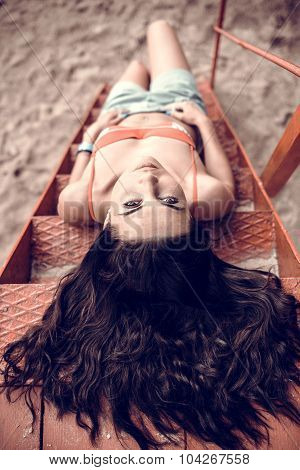 Long Hair Girl Relaxing On The Beach