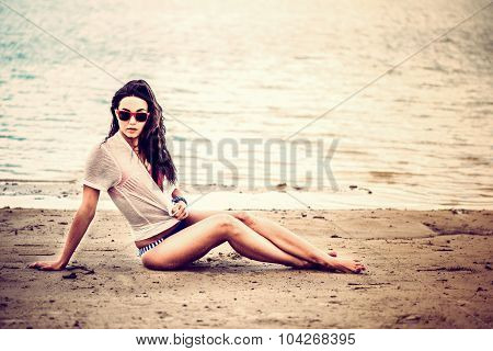 Long Hair Girl Relaxing On The Beach