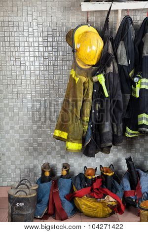 Firefighter suits and equipment arranged at fire station