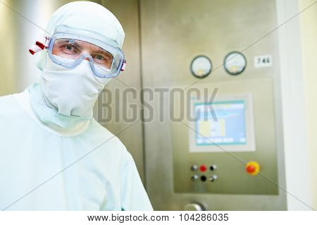 pharmaceutical staff worker in protective uniform at pharmacy industry manufacture factory