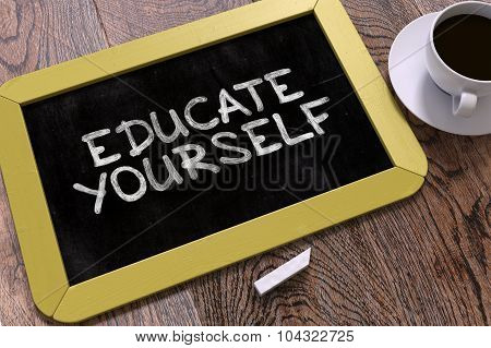 Educate Yourself Handwritten on Chalkboard.