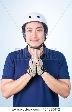Asian Guy Welcome Greeting Sawasdee With Bicycle Helmet And Gloves,