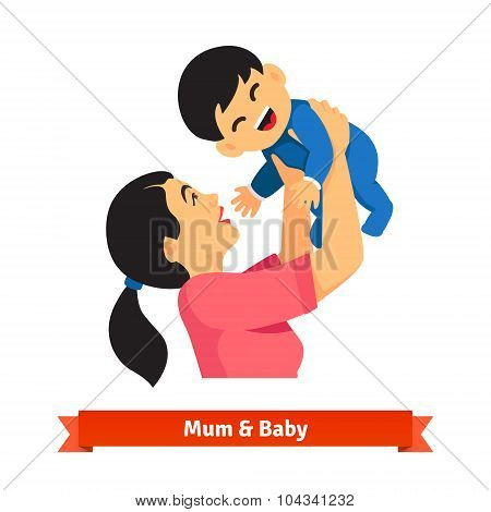 Asian mum holding up her baby in hands over head