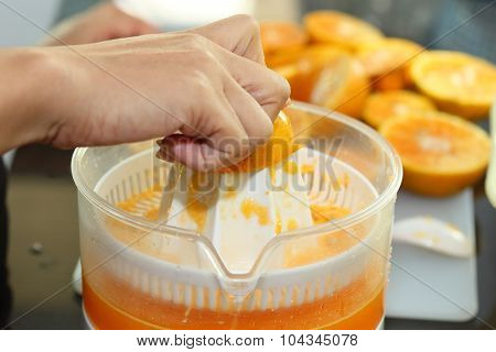 Orange Fruit Squeezed With Woman Hand In Juicer Machine, Orange Juice