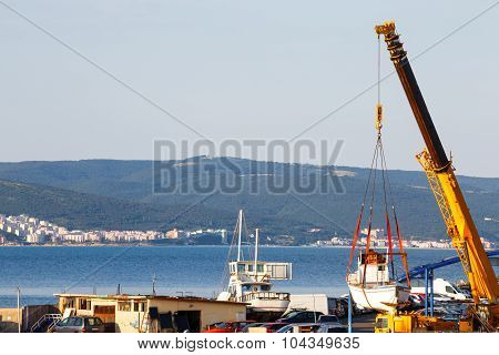 Moving Of Boat With Crane In A Port