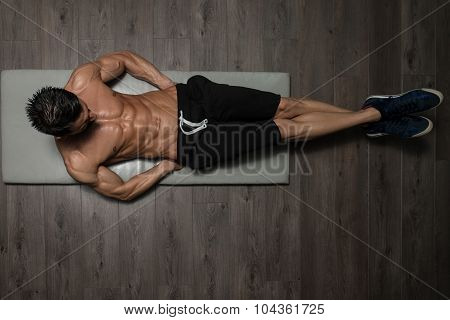 Healthy Man Doing Abdominal Excerise On Foor
