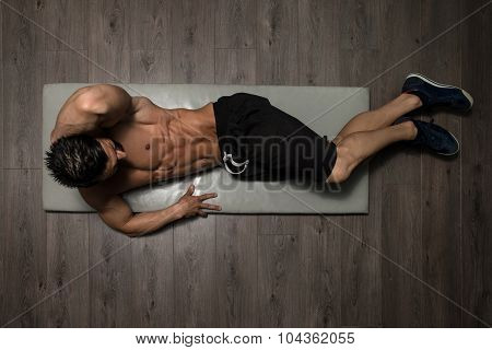 Healthy Man Doing Abdominal Excerise On Foor