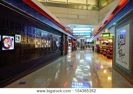 DUBAI, UAE - SEPTEMBER 08, 2015: Dubai Airport interior. There are a lot of restaurants, bars, cafes and shops in Dubai International Airport. Almost all of them are open twenty-four hours.
