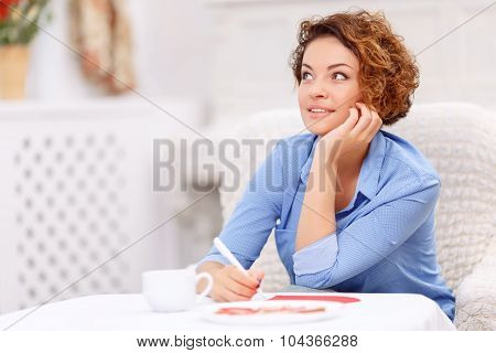 Nice girl sitting at the table