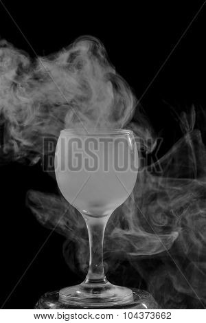 Smoke Shisha In Cocktail Glass On A Black Background.
