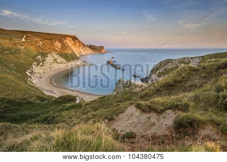 Stunning Natural Cove Coastal Landscape At Sunset With Beautiful Vibrant Sky