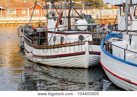 Small Fishing Boats In The Harbor