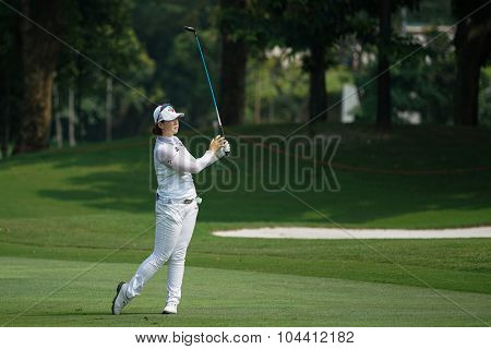 KUALA LUMPUR, MALAYSIA - OCTOBER 09, 2015: South Korea's Q Baek plays her shot from the sixth hole fairway of the KL Golf & Country Club at the 2015 Sime Darby LPGA Malaysia golf tournament.