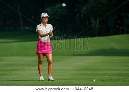 KUALA LUMPUR, MALAYSIA - OCTOBER 09, 2015: Australia's Minjee Lee prepares to hit from 6th hole fairway at the KL and Golf & Country Club at the 2015 Sime Darby LPGA Malaysia golf tournament.