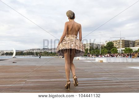 Models Walk An During  Outdoor Fashion Show With Clothing Made Out Of Recycled Materials Was Held In