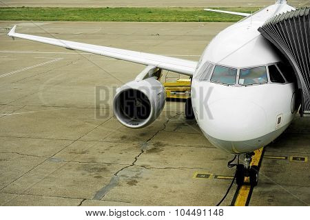 Airplane Connected To Jetway
