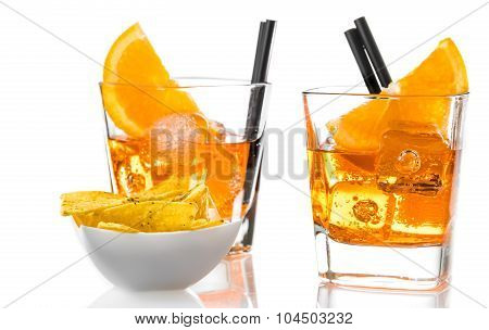 Glasses Of Spritz Aperitif Aperol Cocktail With Orange Slices And Ice Cubes Near Tacos Chips