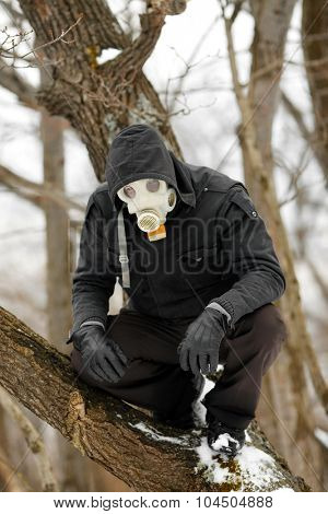 Man in Gas Mask lurking in the forest