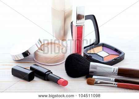 Cosmetics make-up on white wooden. background. Mock up.