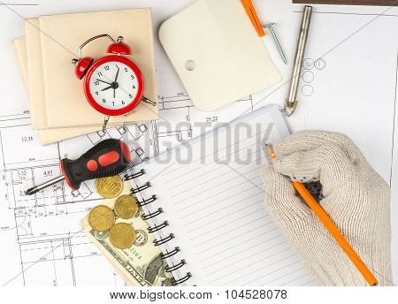 Copy book with tiles and humans hand