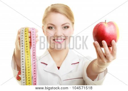 Doctor Specialist Holding Fruit Apple And Measure Tape