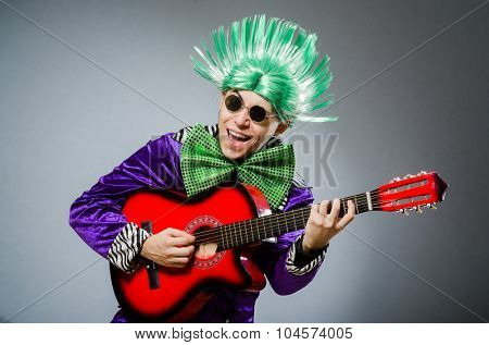 Funny man playing guitar in musical concept