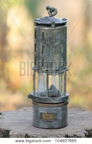 Old Rustic Oil Lamp On The Stump