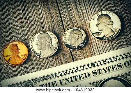 New uncirculated US money over wooden background