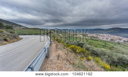 Guadalupe village and road with cloudy sky