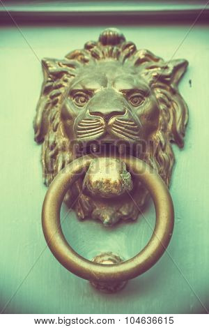 doorknocker like lion head , tero style toned photo