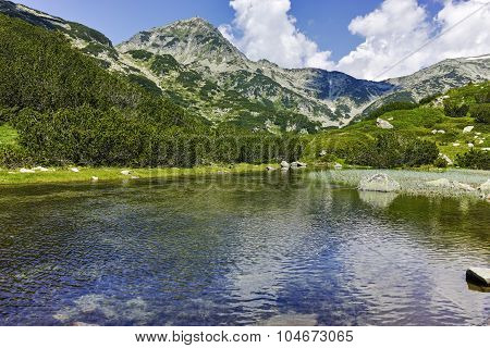Reflection of Muratov peak in Mountain river, Pirin Mountain