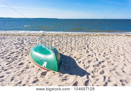 Empty boat on sand at a beach