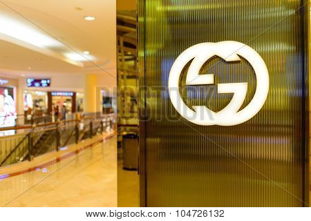 KUALA LUMPUR, MALAYSIA - APRIL 23, 2014: Gicci logo on the wall. Gucci is an Italian fashion and leather goods brand, part of the Gucci Group