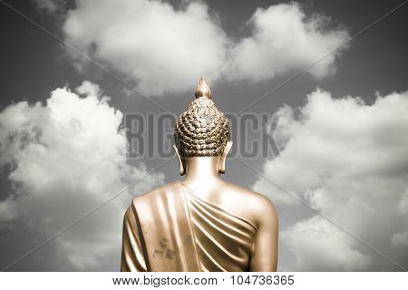 Golden Buddha Statue From Back Focused On Head  Golden Split-tone Black And White