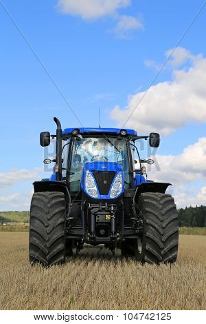 New Holland T7.250 Tractor On Stubble Field, Vertical View