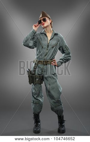 Sexy Girl Dressed As A Helicopter Pilot Posing In Sunglasses