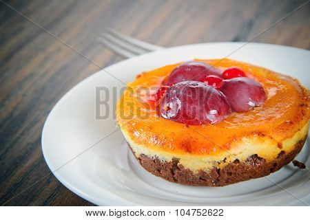 Fruit Cake on Vintage Retro Woody Background