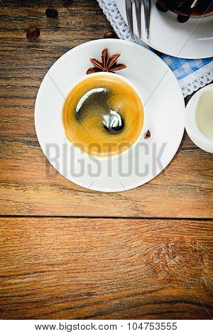 Cup of Coffee on Woody Background in Retro Vintage Style