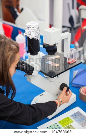 Student Using A Microscope