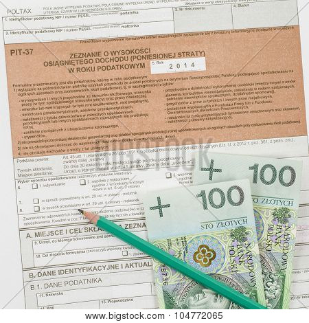 Polish tax form with pencil and cash