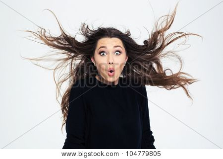 Portrait of amazed young girl looking at camera isolated on a white bakground