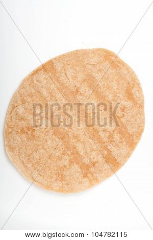 homemade whole wheat  mexican tortilla on white